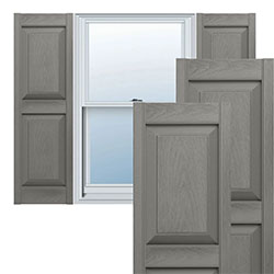 Stylish raised panel vinyl shutters frame a window, enhancing curb appeal with a modern gray finish, perfect for adding charm to any home exterior.
